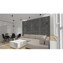 Cegła gipsowa ułożona w pokoju dziennym, salonie w stylu loft od Petraart